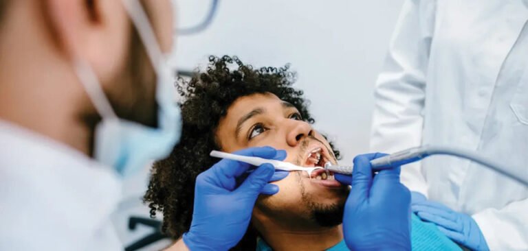 Dentist checking loose dental filling