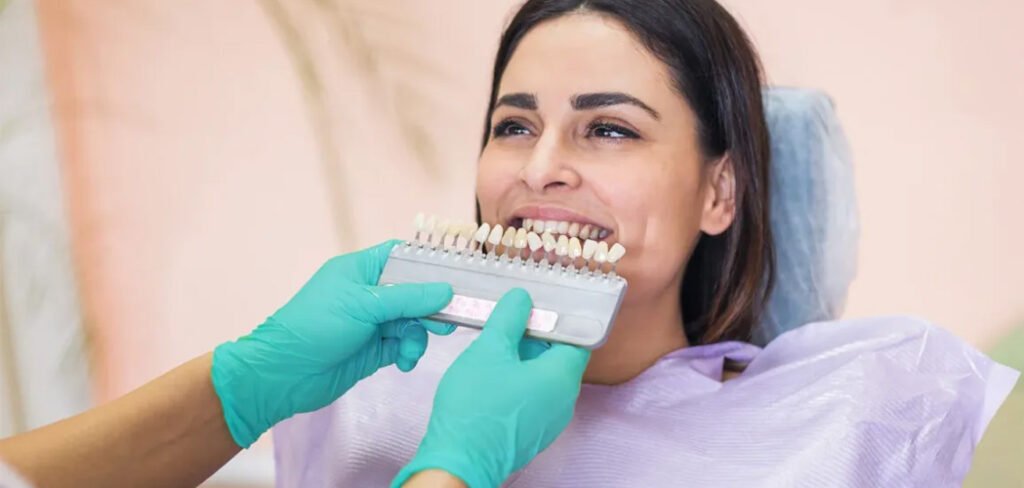 Dentist matching a dental crown shade